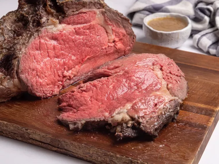 Prime rib roast in a roasting pan.