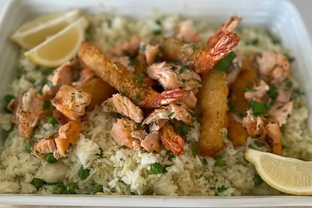 "Crispy Garlic Prawn Rice Bake with golden panko topping and lemon wedges"