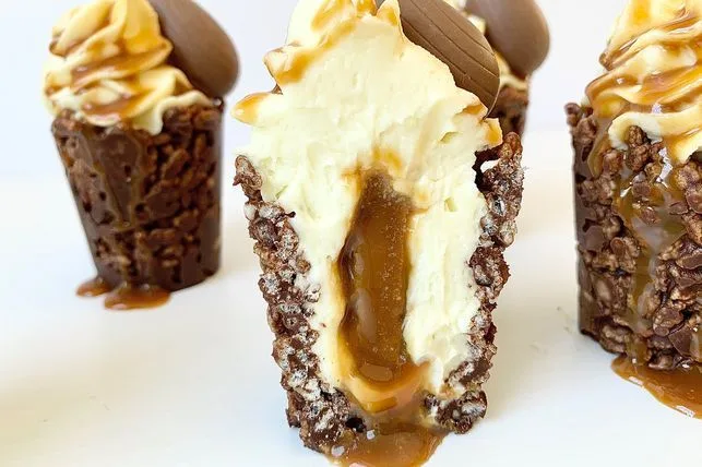 "Chocolate Crackle Cheesecake Cups: Crunchy chocolate crackle base with creamy cheesecake filling topped with melted chocolate"